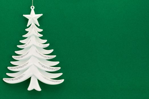 Christmas tree on a background of green velvet paper