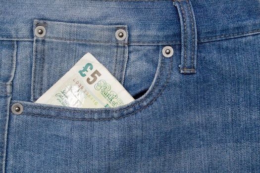 Denim jeans pocket with five pound note