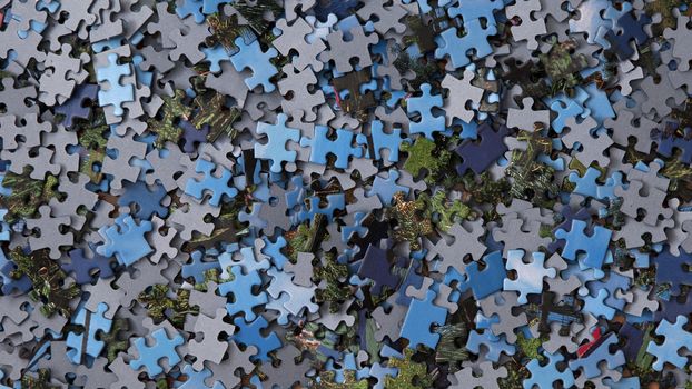 A jigsaw puzzle is a tiling puzzle that requires the assembly of numerous small, often oddly shaped, interlocking and tessellating pieces.