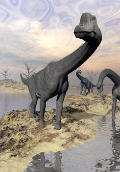 Three brachiosaurus dinosaurs in desert near water with reflection by sunset and full moon