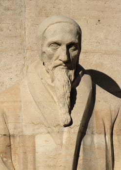Close up of Jean Calvin statue on reformation wall in Parc Des Bastions, Geneva, Switzerland.
