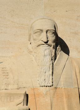 Close up of Theodore de Beze statue on reformation wall in Parc Des Bastions, Geneva, Switzerland.