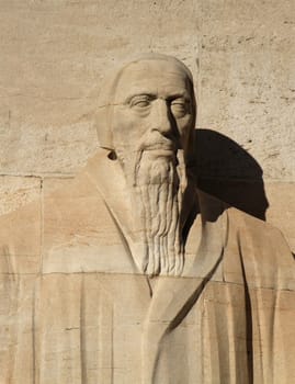 Close up of Guillaume Farel statue on reformation wall in Parc Des Bastions, Geneva, Switzerland.