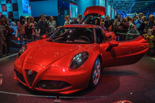 FRANKFURT - SEPT 21: ALFA ROMEO 4C presented as world premiere at the 65th IAA (Internationale Automobil Ausstellung) on September 21, 2013 in Frankfurt, Germany