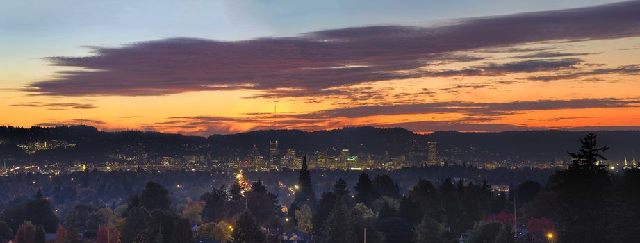 Colorful Sunset Over Portland Oregon Cityscape with City Lights and View of West Hills Panorama