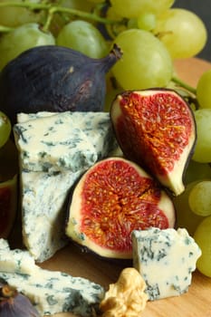 Cheese and figs on a table close up