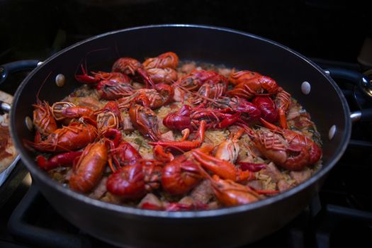 A beautiful skillet full of crawfish jambalaya. This dish was created in the southern United States, in Lousiana.