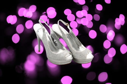 silver shoes on abstract city background