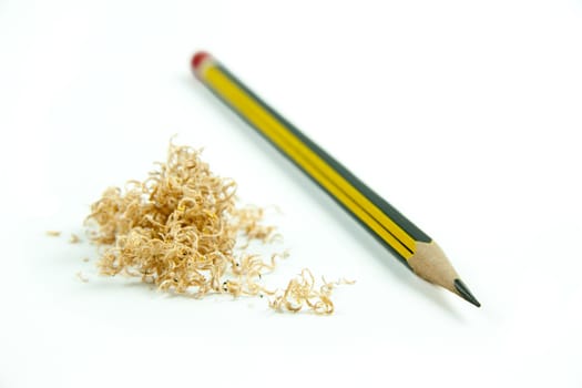 Wooden pencil with shavings isolated on white background