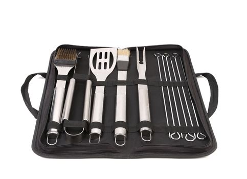 Set of tools for bbq in black bag. White background.