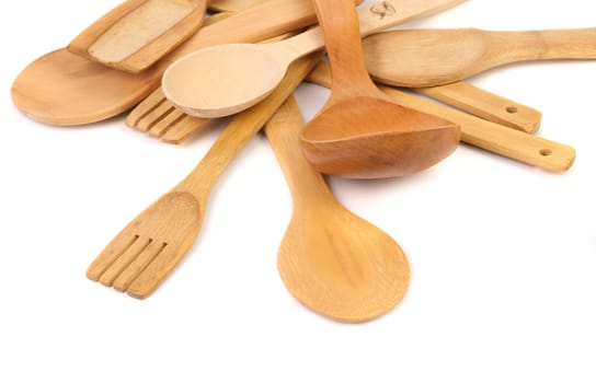 different kitchen wooden utensils cutlery close up on a white background