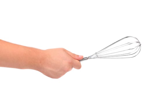 Hand holds stainless steel whisk isolated on white background
