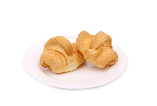 Fresh croissants on plate. Isolated on a white background.