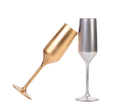 Golden and silver champagne glasses. White background.