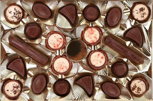 Background of Box with Chocolate Candy. Close up.
