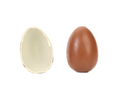 One and half chocolate egg. White background.