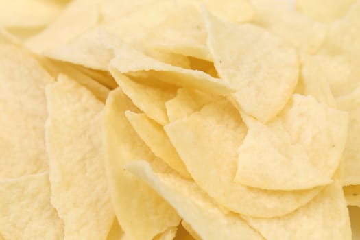 Background of potato chips. Close up. Texture.
