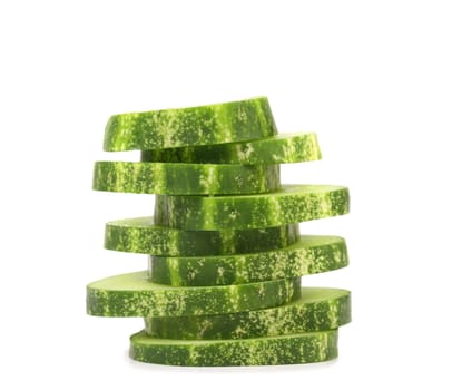 Stack of sliced fresh cucumbers. Isolated on a white background.