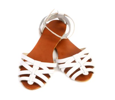 Pair of white leather female sandals isolated on the white background