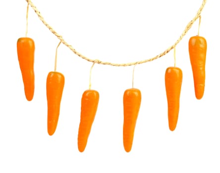 Close-up of a toy carrot. Isolated on a white background.