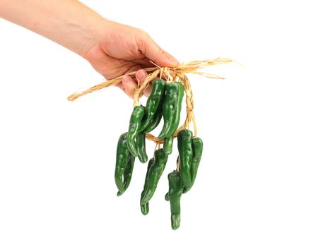 Artificial green chili peppers isolated on white background