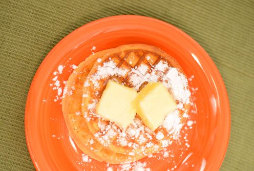 two waffles and powdered sugar for comfort food