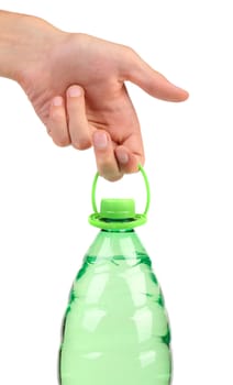Hand holds plastic bottle with water without label. Close up.
