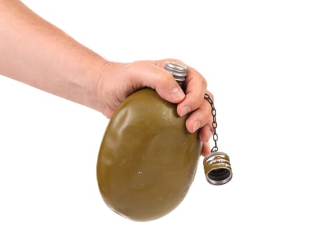 Hand holds old army canteen. White background.