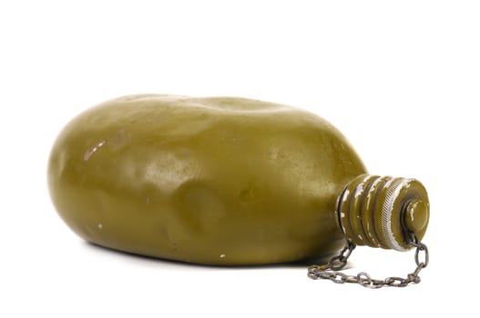 Hand holds old army canteen. White background.