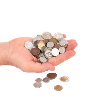 Hand holds coins. Isolated on a white background.