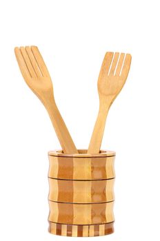Wooden kitchen utensils in a jar. White background.