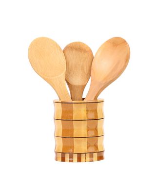 Wooden kitchen utensils in a jar. White background.