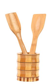 Wooden kitchen utensils in a jar. White background.