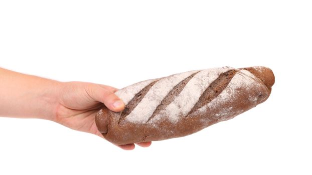 Hand holds rye breads. Isolated on a white background