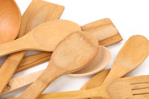 Wooden kitchen utensils. Isolated on a white background.