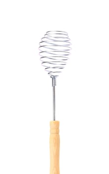 Whisk with wooden handle. Isolated on a white background.