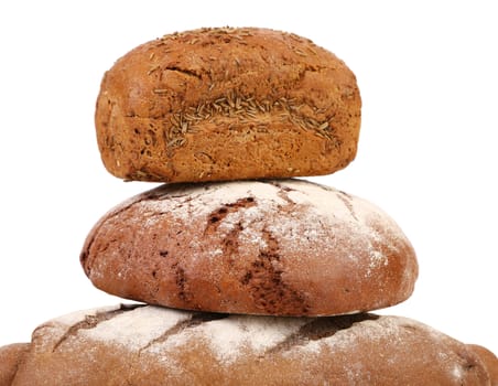 Pyramid of brown breads. Isolated on a white background.