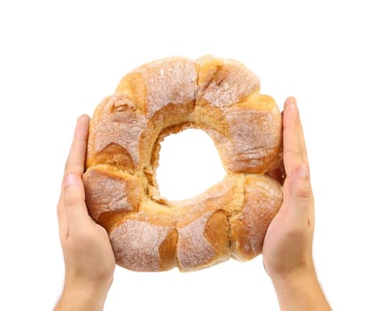 Hands holds white kalatch. Isolated on a white background.