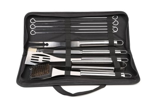 Set of tools for bbq in black bag. White background.