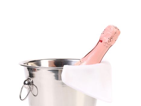 Bottle of champagne in cooler. Whitte background.
