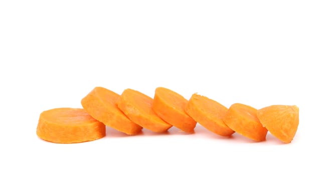 Raw carrot slices on a white background