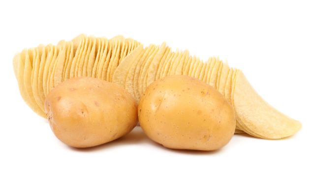 Potatoes and row of chips. White background.