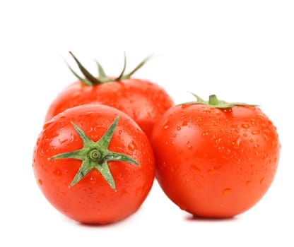 Tomatoes with drops isolated on a white background.