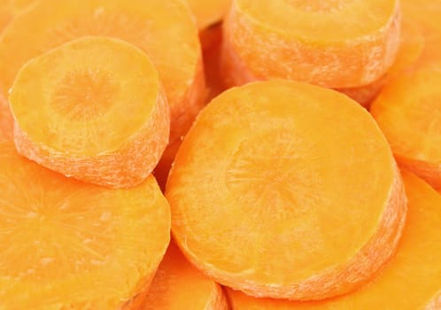 Background of fresh organic carrots sliced. Close up.