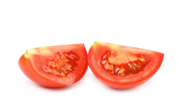 Two sedments of fresh tomato. White background.