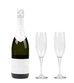 Champagne bottle and two glasses isolated on white