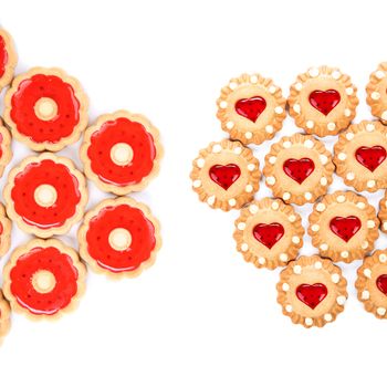 Heart and round shaped strawberry biscuits. White background.