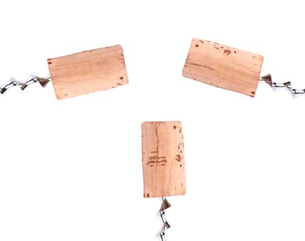 Collage of corks and corkscrews.  White bacground.