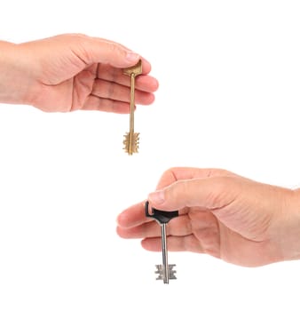Hands holds modern steel-plastic and bronze key. White background.
