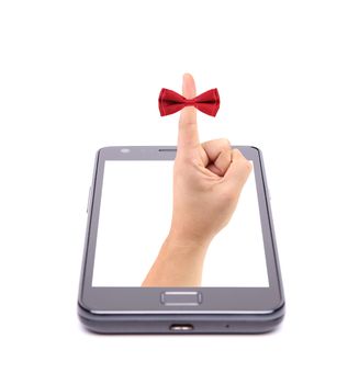 Hand and red tie bow gets out of phone. White background.